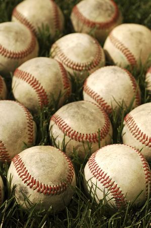 Nostalgic baseballs in the grass on a baseball field の写真素材