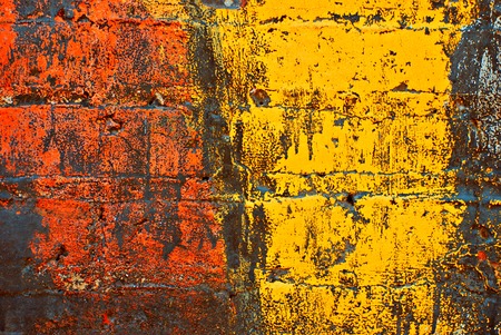 Deteriorating painted brick wall stylized with grunge effects (part of a photo illustration series)