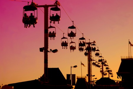 Silhouette of the Gondola at sunset on the Santa Cruz Boardwalk in Californiaの写真素材