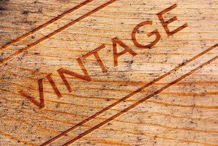 Vintage burned onto a moldy wooden wine box