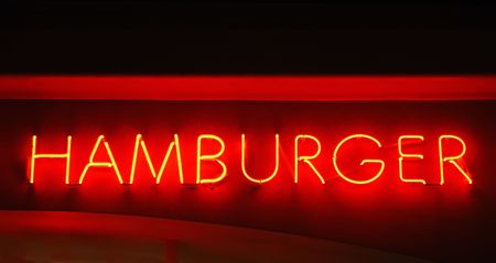 Hamburger neon sign hanging above a restaurantの写真素材