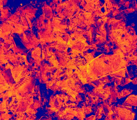 Macro of a broken green glass bottle on asphalt in infrared - photo illustrationの写真素材