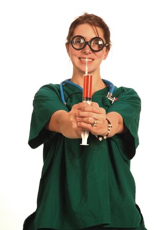 Crazy nurse with a fluid filled syringeの写真素材