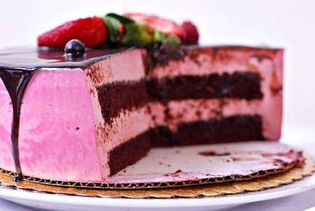 Fresh raspberry cream chocolate cake on paper plateの写真素材