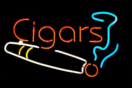 Cigars with smoke neon sign isolated on black backgroundの写真素材