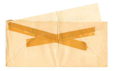 Vintage envelope with tape with letter insertの写真素材