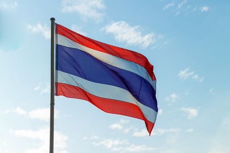 waving national flag of Thailand on blue sky background