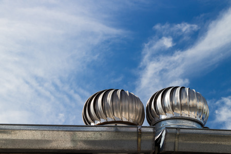 Roof Ventilation on blue sky and cloud backgroundの写真素材