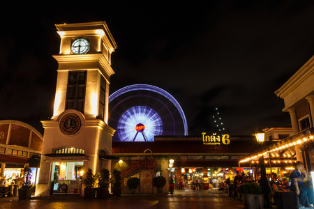 BANGKOK, THAILAND - MAY 19: Clock tower and ferris wheel at Asiatique The Riverfront  on May 19,2015 in Bangkok, Thailand. Asiatique The Riverfront is a large open-air marketのeditorial素材