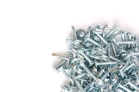 Silver metallic screws group on white background