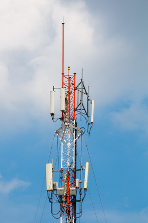 Telecommunication tower with blue sky background photo