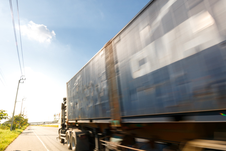 truck transport on the road with motion blur techniqueの写真素材