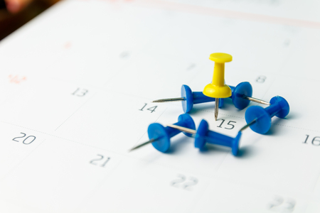 close up color pin marker at calendar, appointments conception and copy spaceの写真素材