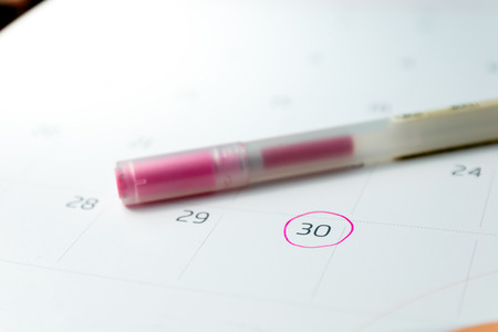 close up calender and marking with pink circle and pen, very soft focusの写真素材