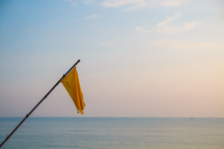 flag with bamboo on natural blue sky backgroundの写真素材