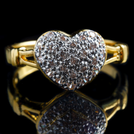 close up gold diamond ring with reflectionの写真素材