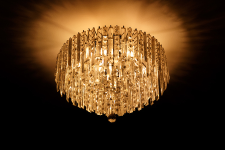 close up chandeliers hanging with black background