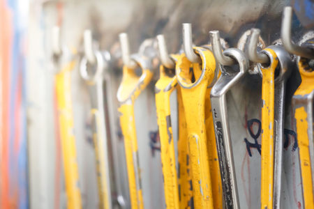 close up old wrench hanging on the wallの写真素材