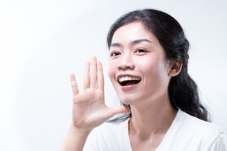 beauty asian woman long black curly hair with white shirt tellingの写真素材