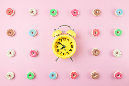 abstract creative paper concept with pastel color tone and yellow alarm clockの写真素材