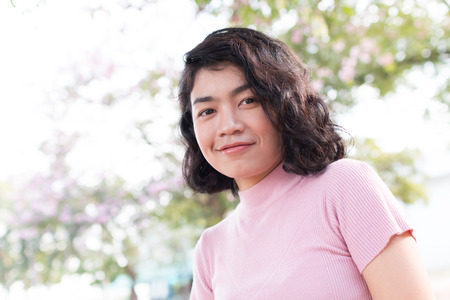 beauty asian woman with cute fashion clothes at outdoor with natural blur backgroundの写真素材