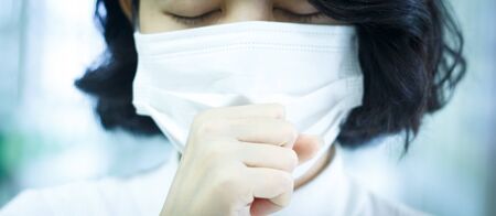 asian woman protection virus with mask on blur hospital background
