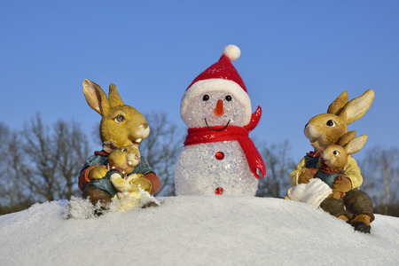 Easter bunny meets Snowmanの写真素材