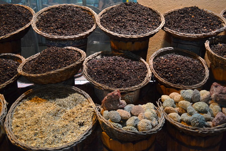 Dried teas and spices in baskets on the traditional marketの写真素材