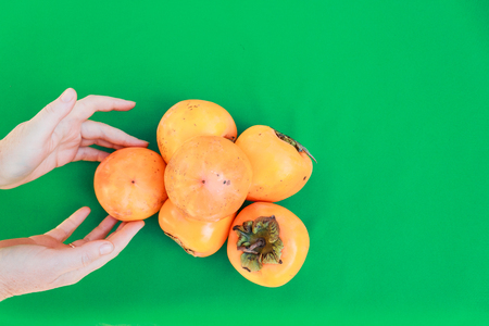 Colorful fruits. Fresh fruit on a green background. View from above. Minimal concept.の写真素材