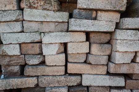 A pile of bricks. Warehouse building materials. Fragment of bricks used as building materialsの写真素材