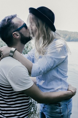 beautiful couple in love kissing outdoorsの写真素材