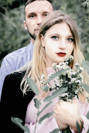 beautiful couple in love kissing outdoorsの写真素材