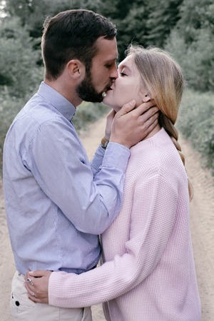 beautiful couple in love kissing outdoorsの写真素材