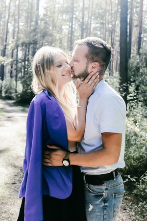 beautiful couple in love kissing outdoorsの写真素材