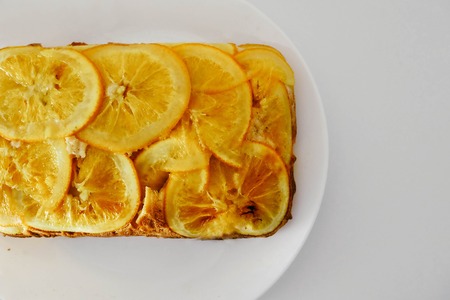 Orange pie on white plateの写真素材