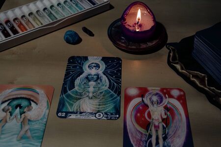 NIZHNY NOVGOROD, RUSSIA - AUGUST 04, 2019: Still life with aura-soma tarot cards and aura-soma bottle setのeditorial素材