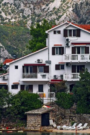 DOBROTA, MONTENEGRO, September 21, 2016: view of the villa with its own beach in the mountainsのeditorial素材