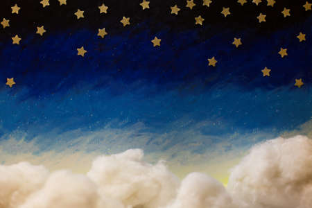 Cartoon painted night sky with bright paper stars and cotton handmade clouds. Blue white gradientの写真素材