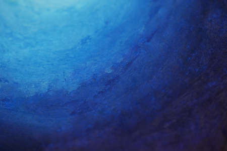 Blue color gradient background created using wax crayons