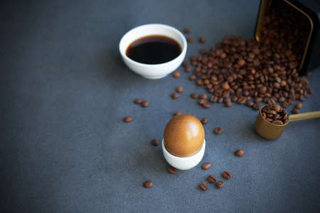 Instructions how to color easter eggs with natural dye. Brown color from coffee. Copy space. Gray...