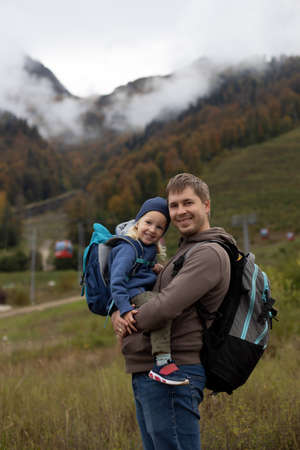 Father daughter little girl hiking mountains autumn day. Family adventureの写真素材
