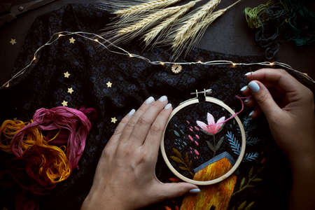 Dark flat lay with embroidery. Craft, handmade, hobbyの写真素材