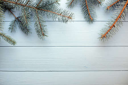 Christmas and New Year wooden background with blue fir tree branches. Copy spaceの写真素材