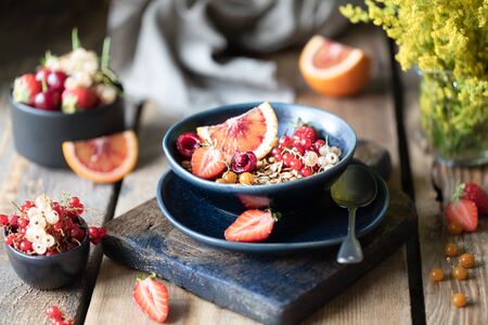 Homemade pumpkin muesli with nuts and seeds in a glass jar for a healthy breakfast. Autumn still...
