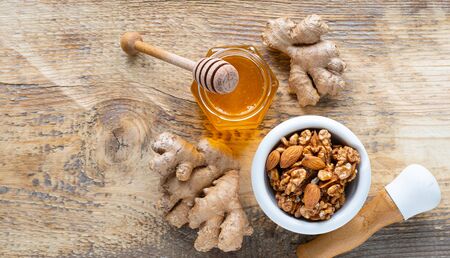 set of products to boost the immune system. Honey, nuts, ginger to Immunity boosting. top view.