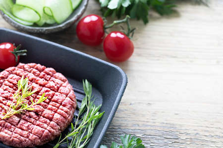 Raw Minced Hamburger Meat with Herb and Spice Prepared for Grilling. copy space top view.