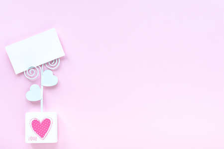 Business card mockup on pink background with copy space