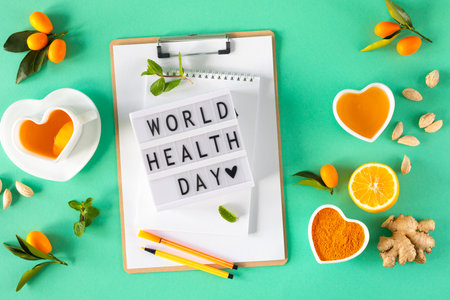 world health day. Tea with lemon and honey, Immunity boosting and cold remedies, top view.の写真素材