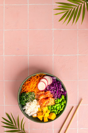 Bowl with salmon, rice and fresh vegetables poke, top view. Verticalの写真素材