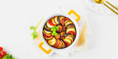 Step 5. Different vegetables. A healthy diet. Ingredients for baking. Vegetable ratatouille on a white background. Top viewの写真素材